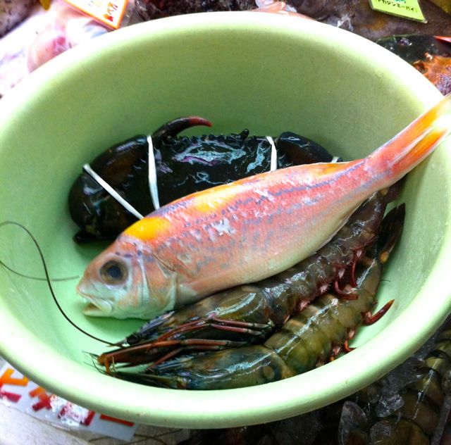 Ordering seafood at Makishi market in Okinawa